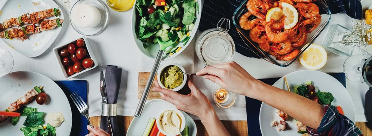 Photo of a table full of a variety of foods.