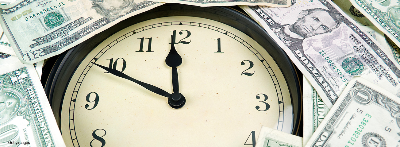 Photo of a clock and money