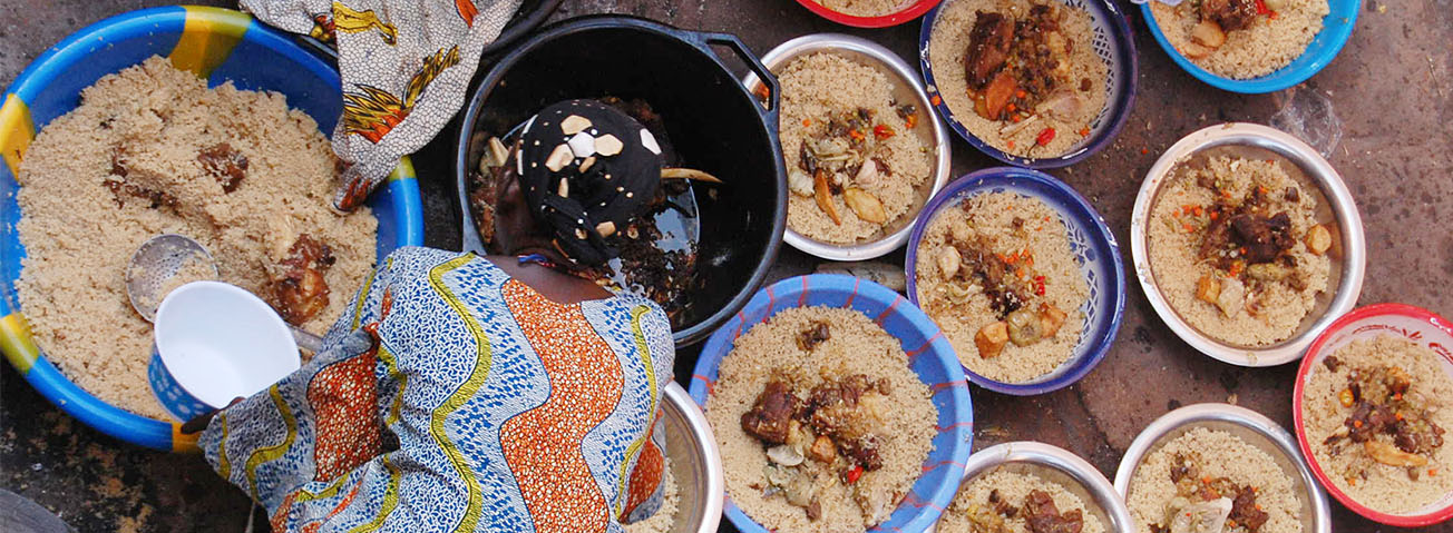 Women scooping grains