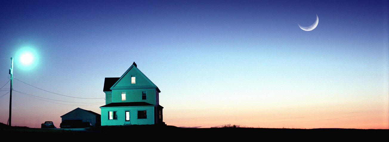 Illustration of a farmhouse with a sunset in the background.