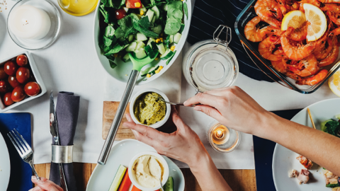 Photo of a table full of a variety of foods.